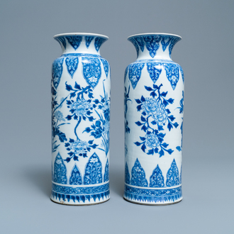 A pair of Chinese blue and white vases with floral designs, Kangxi
