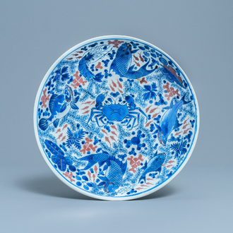 A Chinese blue, white and copper red 'crab and fish' dish, Kangxi