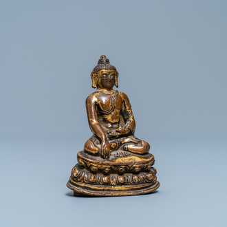 A Sino-Tibetan gilt bronze figure of Buddha Shakyamuni, Ming