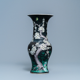 A Chinese famille noire 'magpie and prunus' yenyen vase, Kangxi