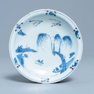 A Chinese blue, white and copper red plate, Ming