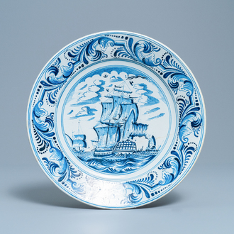 A Dutch Delftware blue and white dish with a large battle ship, Bolsward, Friesland, 18th C.