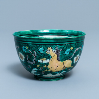 A Chinese verte biscuit bowl with horses, Kangxi