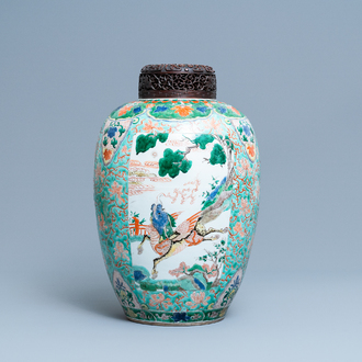 A large Chinese famille verte 'mythical beasts' jar with wooden cover, Kangxi