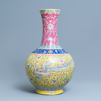 A large Chinese yellow-ground famille rose 'dragon and phoenix' bottle vase, 19th C.