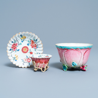 A Chinese famille rose cup and saucer and a 'magnolia' cup, Yongzheng