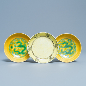 Three Chinese yellow-ground saucer dishes, 19/20th C.