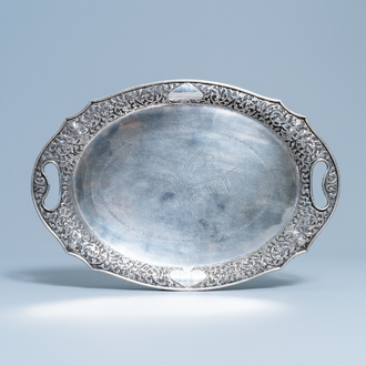 An oval silver tray with incised floral design, Thailand, 19/20th C.