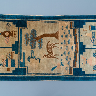 A rectangular Chinese hand-knotted wool carpet with a crane and a deer, 19/20th C.