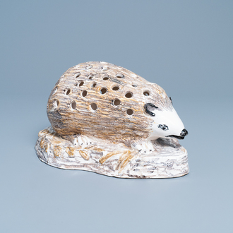 A polychrome faience flower holder shaped as a hedgehog, Northern France, 18/19th C.