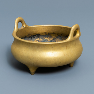 A Chinese gilt bronze tripod censer, Xuande mark, 19/20th C.