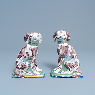 A pair of polychrome Dutch Delft money banks modelled as dogs, 18th C.