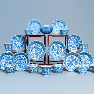 A varied collection of Chinese blue and white cups and saucers, Kangxi