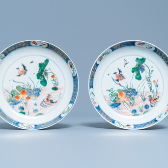 A pair of Chinese famille verte 'ducks in a lotus pond' plates, Kangxi