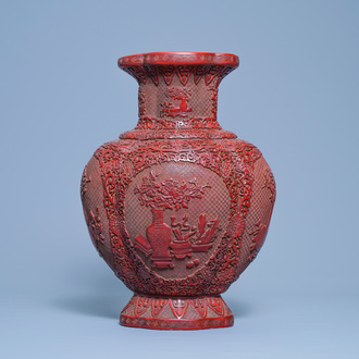 A Chinese carved red lacquer vase, Qianlong mark, 19/20th C.