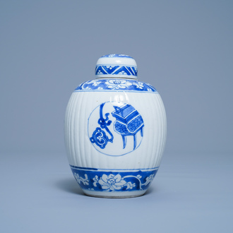 A Chinese ribbed blue and white jar and cover, Kangxi