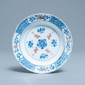 A Chinese blue, white and copper red 'fish' plate, Chenghua mark, Kangxi