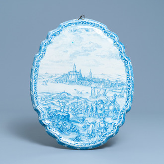 A large Dutch Delft blue and white plaque with a view on the city of Nijmegen, 18th C.