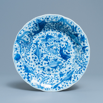 A Chinese blue and white lobed dish with fish, Kangxi