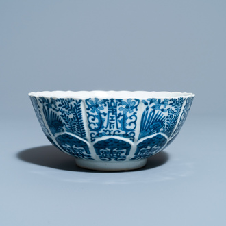 A Chinese blue and white lotus-molded bowl, Jiajing mark, 19th C.