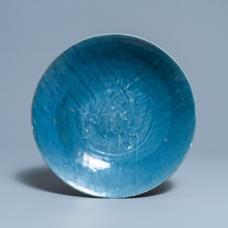 A Chinese monochrome blue Swatow dish with incised carp design, Ming