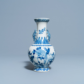 A Chinese blue and white vase with a bird among blossoms, Qianlong mark, 19th C.