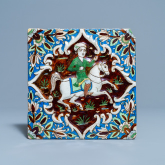 Un carreau polychrome à décor d'un prince sur cheval, art qajar, Iran, 19ème