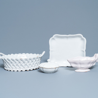 A white Delftware basket, a lobed dish, a spice box and a sauce boat, 18th C.