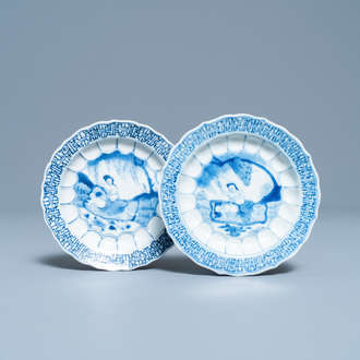 A pair of Chinese blue and white 'acupuncture' saucers, Kangxi