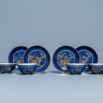 Four Chinese gilt-decorated blue-ground cups and saucers with fine landscapes, Qianlong