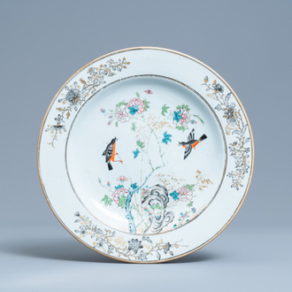 A Chinese famille rose, grisaille and gilt dish with birds among branches, Yongzheng/Qianlong