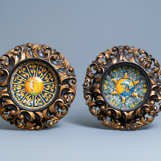 Two polychrome Italian maiolica crespina in finely carved wooden frames, Faenza and Montelupo, 16/17th C.