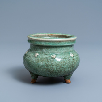 A Chinese monochrome celadon and crackle-glazed tripod censer, Ming