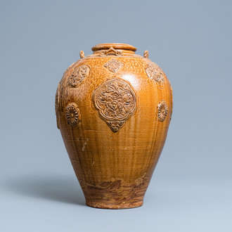 A Chinese brown-glazed relief-molded martaban jar with floral panels, Qing