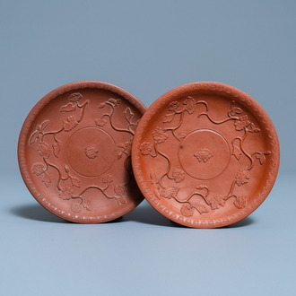 A pair of Chinese Yixing stoneware dishes with applied design, Kangxi