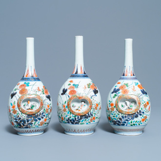 Three Japanese Imari bottle vases with molded panels, Edo, 17/18th C.