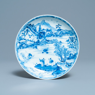 A Chinese blue and white plate with figures in a landscape, Yonzheng