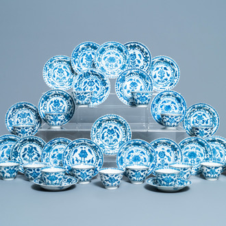 Seventeen Chinese blue and white cups and twenty-two saucers with floral design, Kangxi