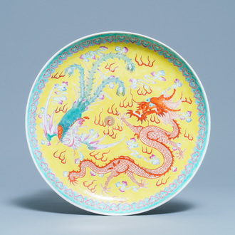 A Chinese famille rose 'dragon and phoenix' yellow-ground dish, Qianlong mark, Republic
