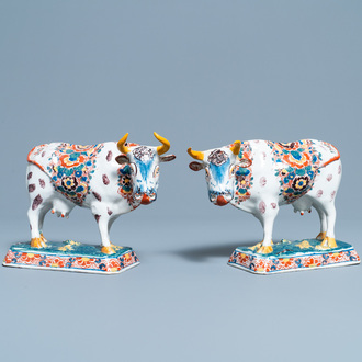 A pair of of polychrome Dutch Delft models of cows, 18th C.