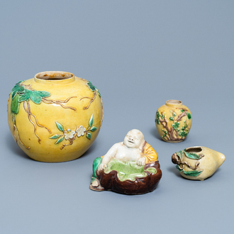 Two Chinese yellow and verte biscuit jars, a Buddha figure and a peach-shaped brush washer, 19/20th C.