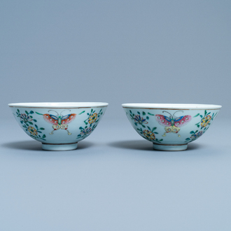 A pair of Chinese famille rose rice grain pattern 'butterfly' bowls, Qianlong mark, 19th C.