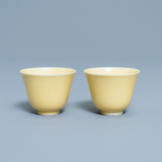 A pair of Chinese monochrome yellow wine cups, Kangxi mark and of the period