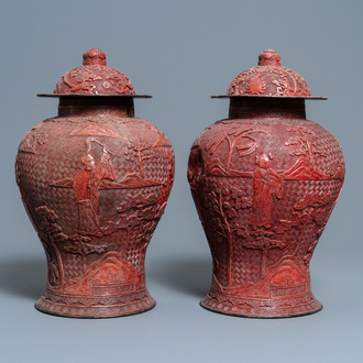 A pair of Chinese red cinnabar lacquer vases and covers, Zhengde mark, Qing