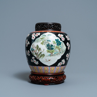 A Chinese black-ground famille rose jar, 19th C.