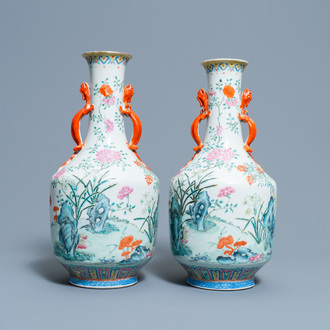 A pair of Chinese famille rose 'floral scenery' vases, Jiaqing mark, 19th C.