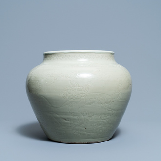 A globular Chinese monochrome celadon 'dragon' vase, Kangxi