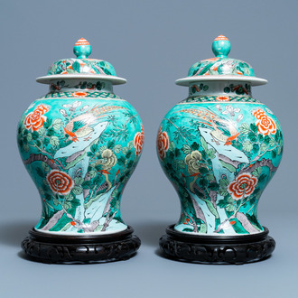 A pair of Chinese turquoise-ground famille verte vases and covers, 19th C.