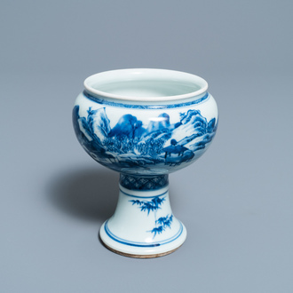 A Chinese blue and white stem cup with a continuous landscape scene, Kangxi/Yongzheng