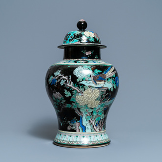 A Chinese famille noire vase and cover, 19th C.